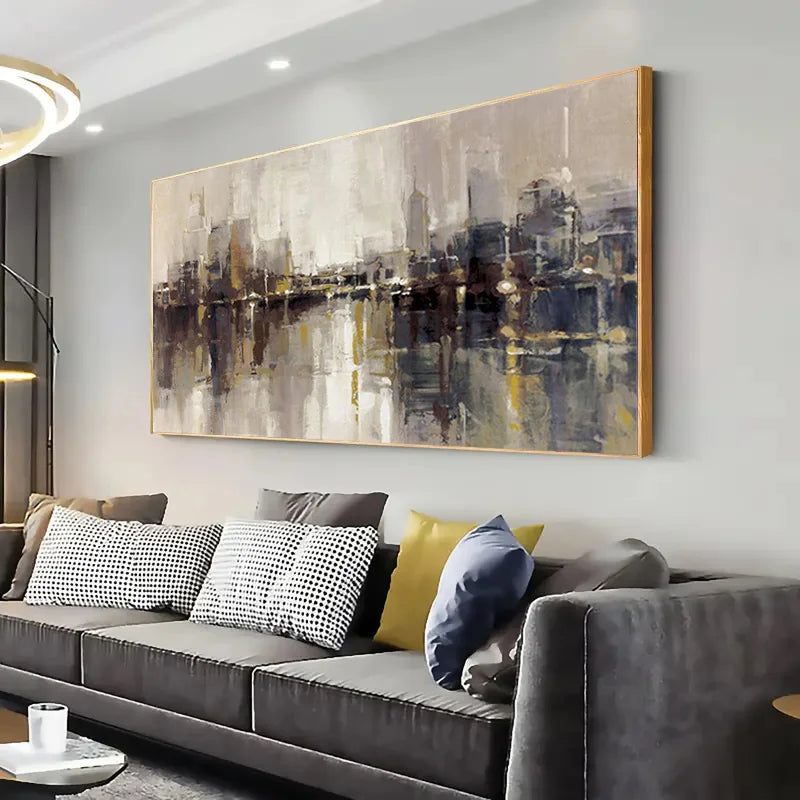 Modern living room with a large abstract painting above a gray sofa.
