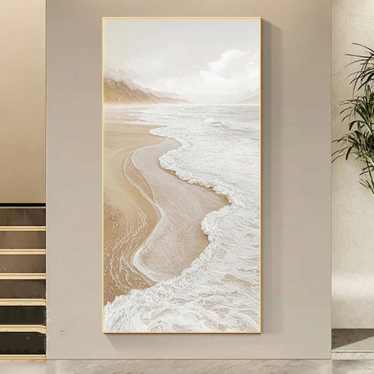 Framed artwork of a beach scene on a wall.