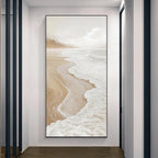 Framed artwork of a beach scene on a wall in a modern interior setting.