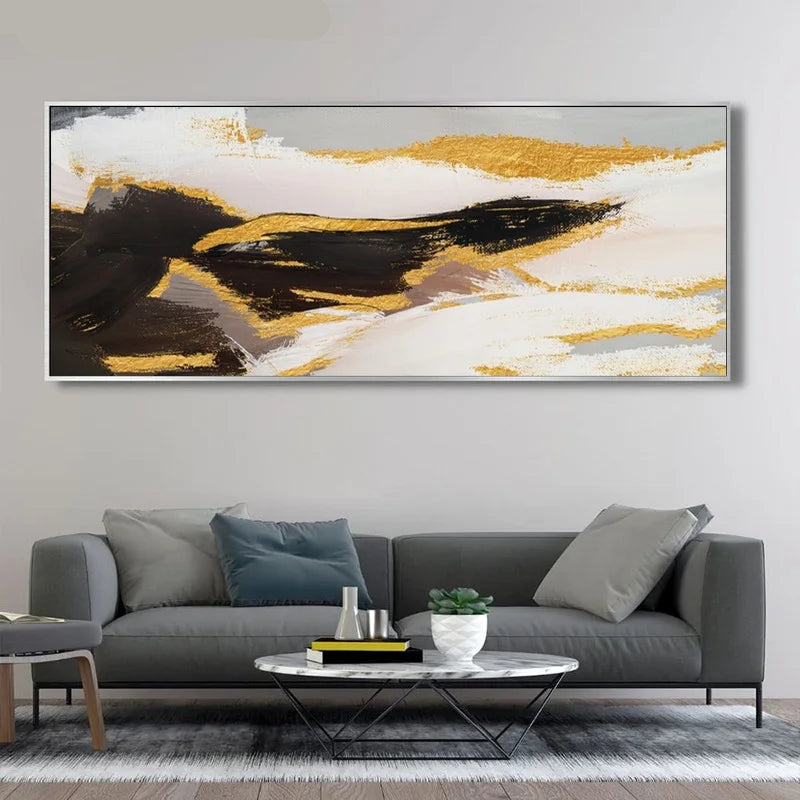 Living room with a gray sofa, round coffee table, and abstract art on the wall.