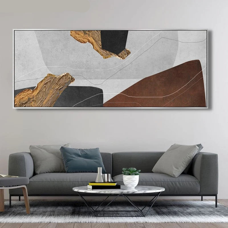 Modern living room with a gray sofa, round coffee table, and abstract art on the wall.