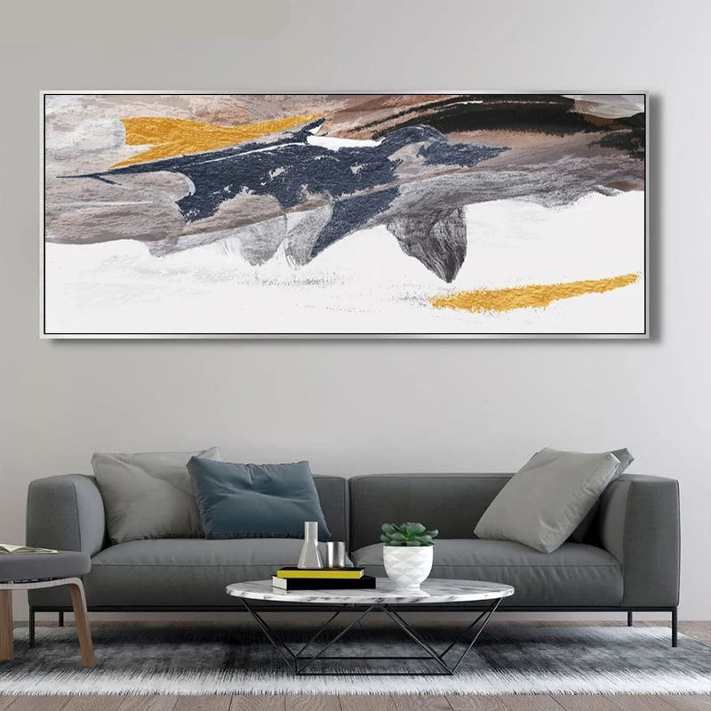 Abstract painting on a wall above a gray sofa in a living room.