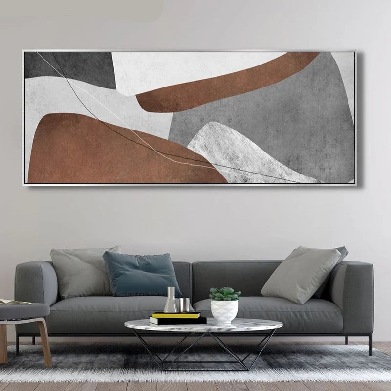 Modern living room with a gray sofa, round coffee table, and abstract wall art.