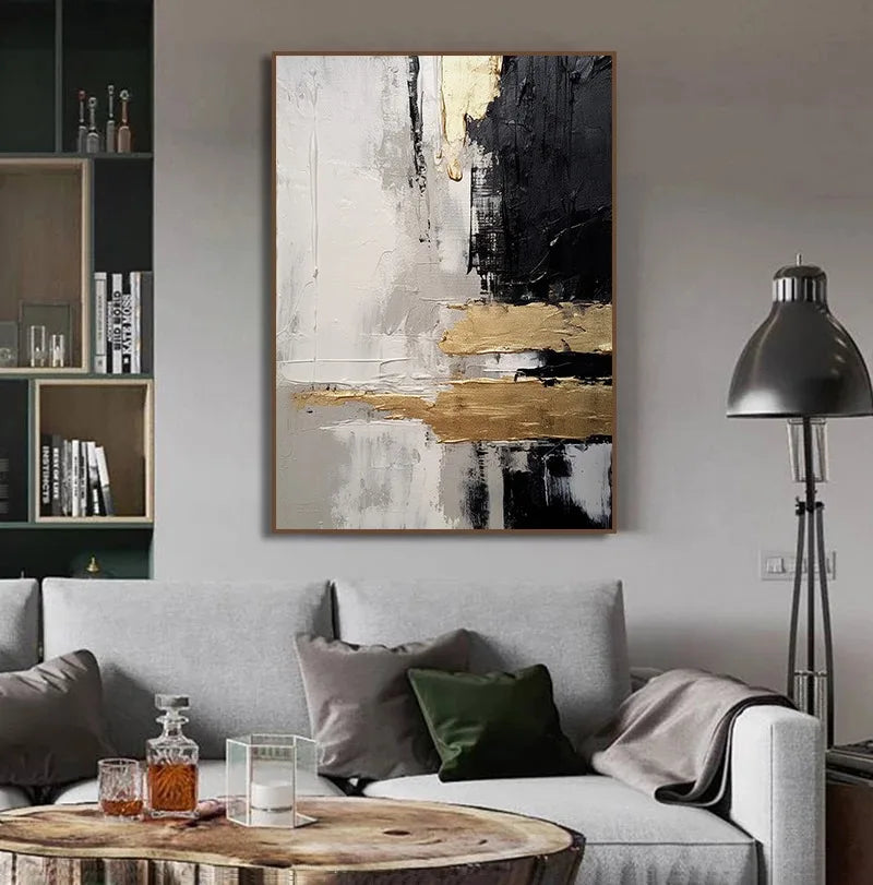 Abstract art piece on a wall above a sofa in a living room setting.