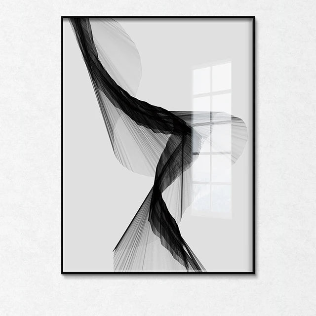 Black and white abstract art print in a frame on a white wall