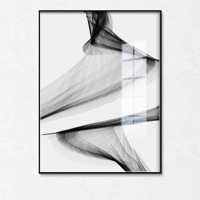 Abstract black and white art print in a frame on a white wall