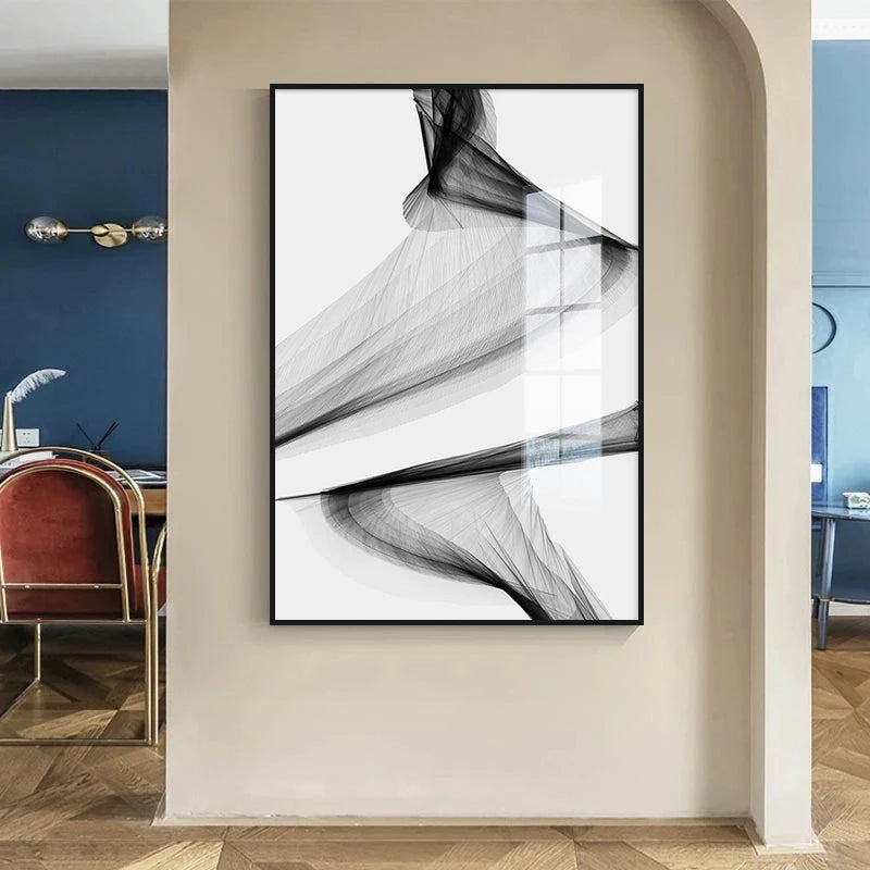 Abstract black and white artwork on a beige wall with a modern interior setting.