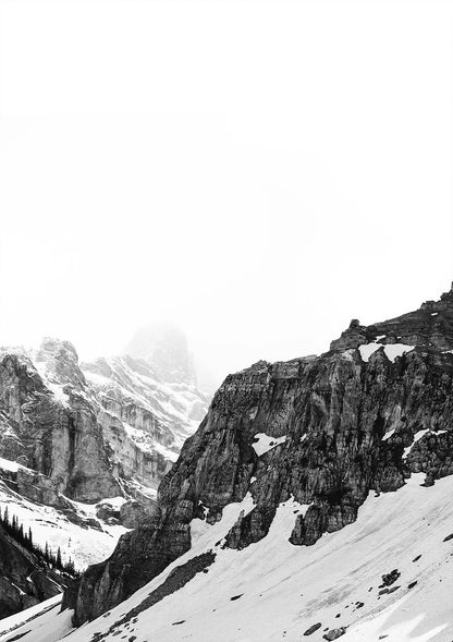 Snowy mountain landscape with rocky cliffs