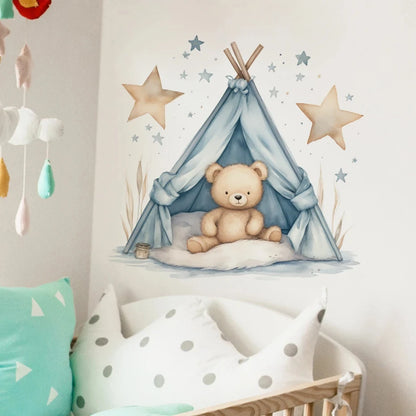 Children's room with a teddy bear in a blue teepee, star decorations, and colorful pillows.