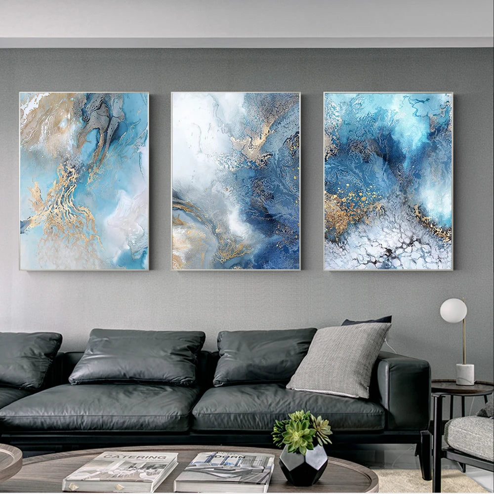 Three abstract wall art pieces above a sofa in a living room.
