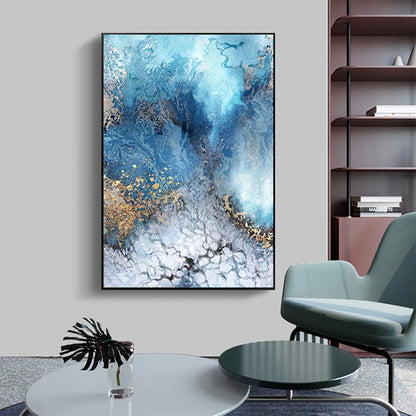 Abstract blue and gold painting on a wall in a modern living room.