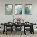 Dining room with a black table and chairs, and abstract art on the wall.