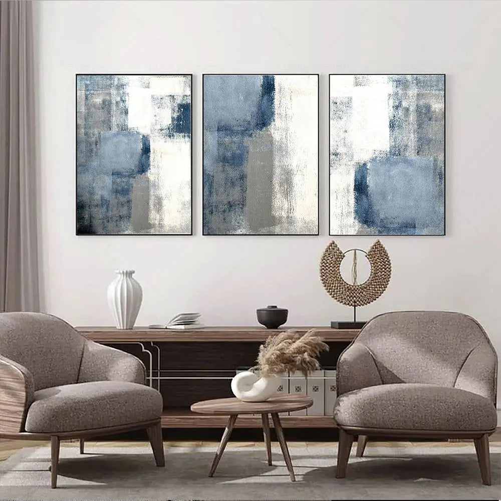 Modern living room with abstract wall art, furniture, and decor items.