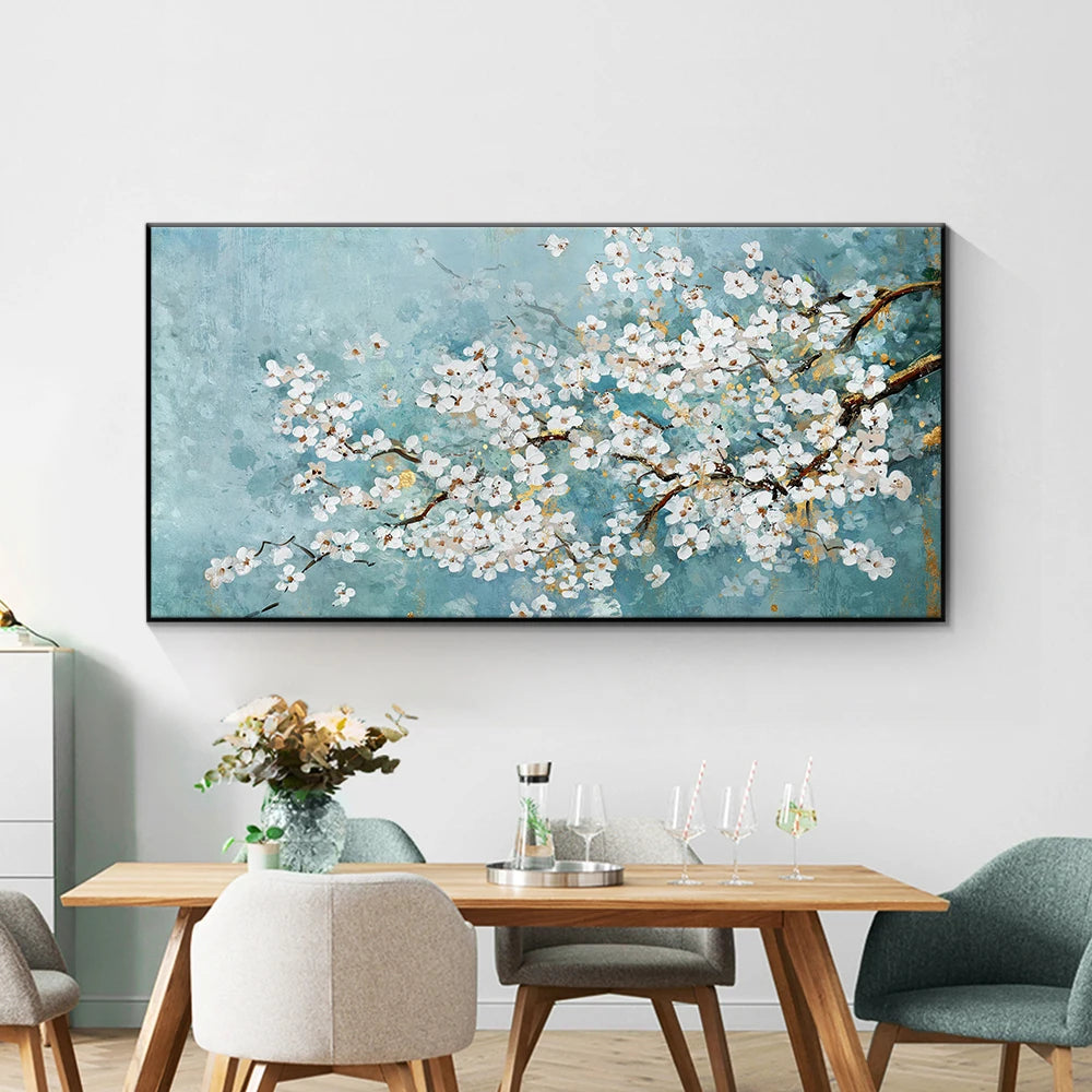 Dining room with a large floral painting on the wall above a wooden table.