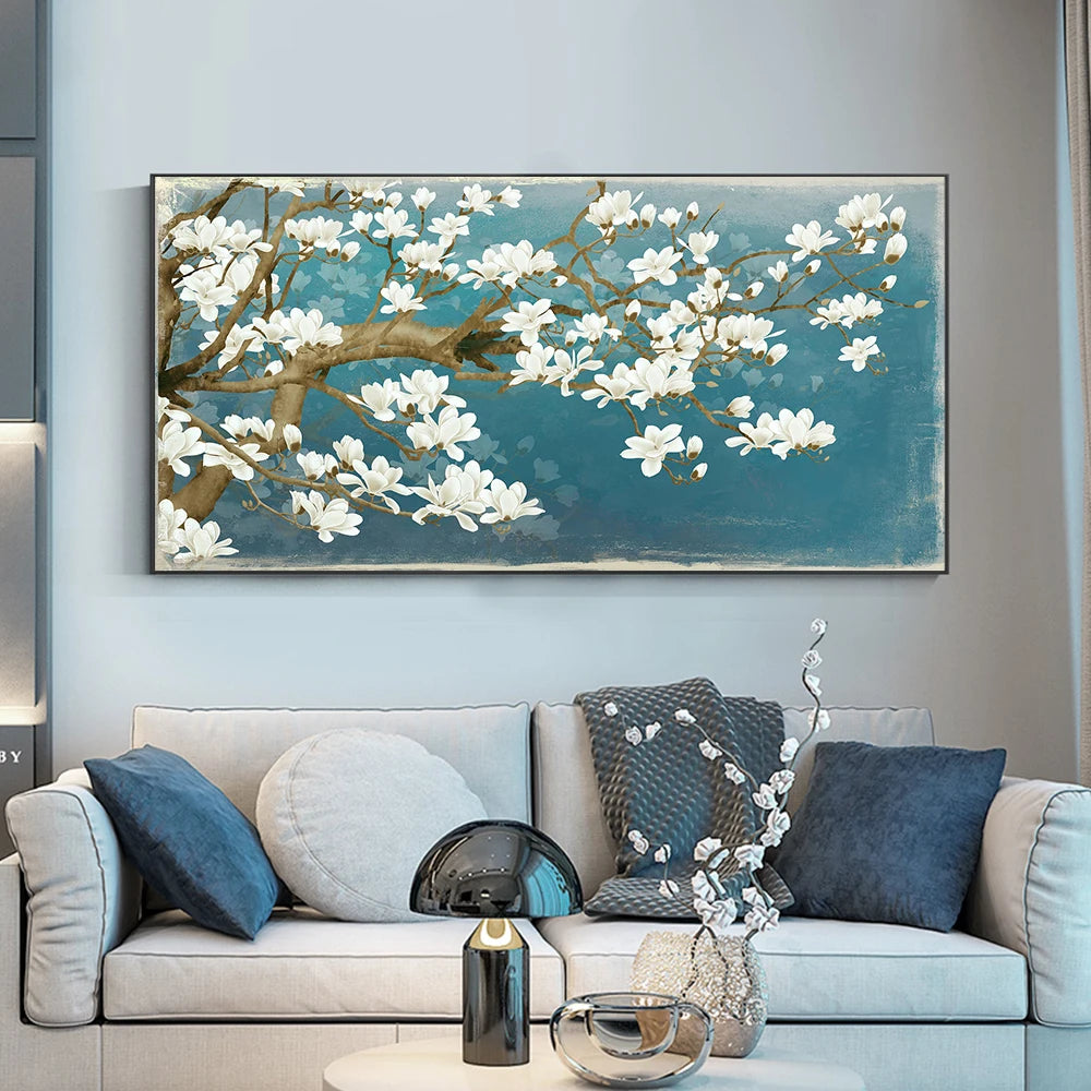 Living room with a large floral painting on the wall above a sofa.