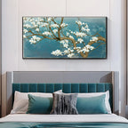 Bedroom with teal upholstered headboard and floral painting on wall