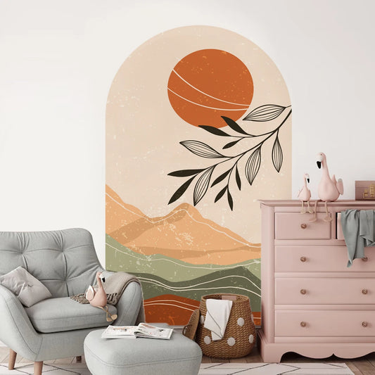 Room interior with a wall mural of a sunset and mountains, a gray armchair, and a pink dresser.
