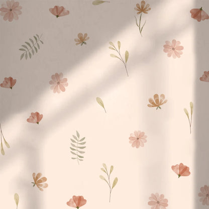 Floral pattern with pink flowers and green leaves on a beige background