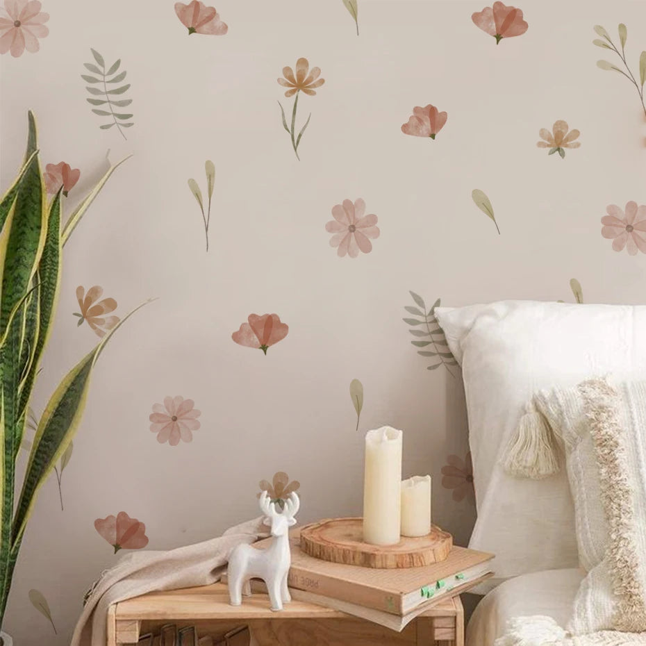 Floral wallpaper with a small table, candles, and decorative items in a room setting.