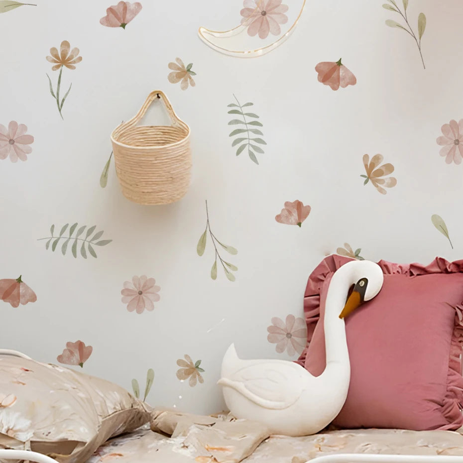 Decorative swan figure on a bed with floral wallpaper and pink pillow