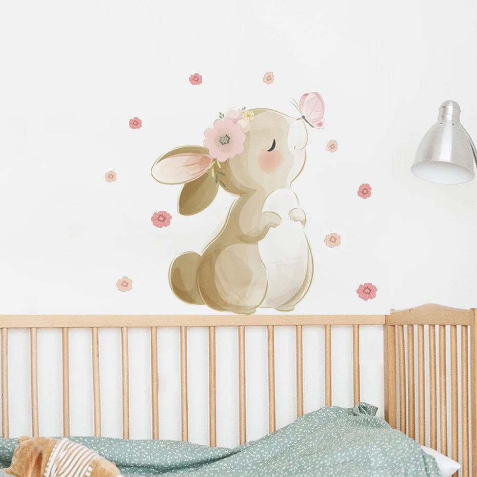 Children's room with a rabbit wall decal above a crib