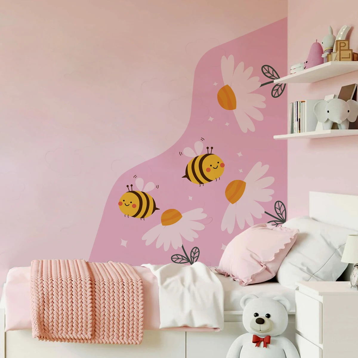 Children's room with pink wall, bee and flower decals, and a teddy bear.