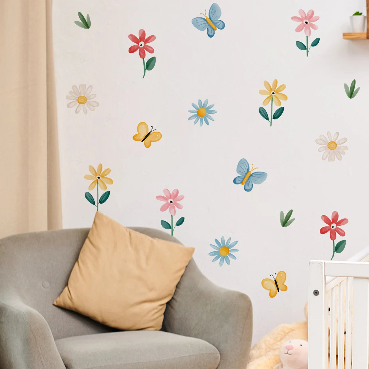 Children's room with colorful flower and butterfly wall decals on a white wall.