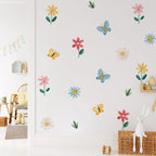 Wall with colorful butterfly and flower decals in a room setting.