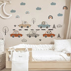 Children's room with wall decals of cars, animals, and nature elements on a beige wall.