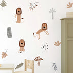 Children's room with lion wall decals on a white wall.