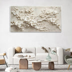 Decorative wall art of floral branches in a living room setting