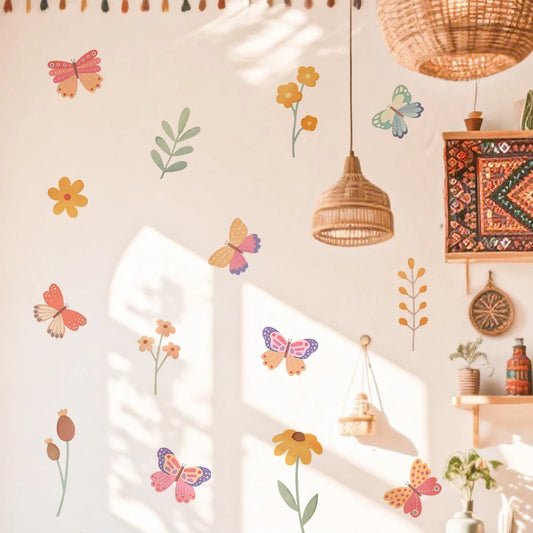 Decorative wall with butterfly and flower decals, hanging lights, and a shelf with decorative items.