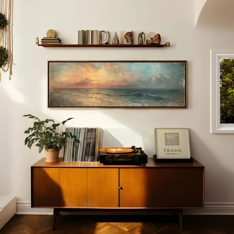 Living room with wooden cabinet, framed artwork, and decorative items.