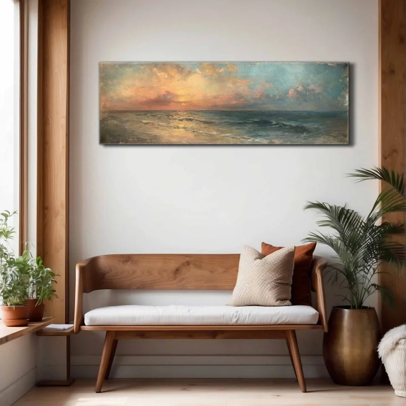 Wooden bench with cushions in a room with a large ocean painting on the wall.