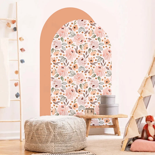 Floral wallpaper design on a wall with a wooden arch, pouf, and teepee in a room.