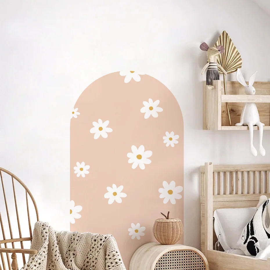 Children's room with a decorative wall panel featuring white flowers on a peach background.