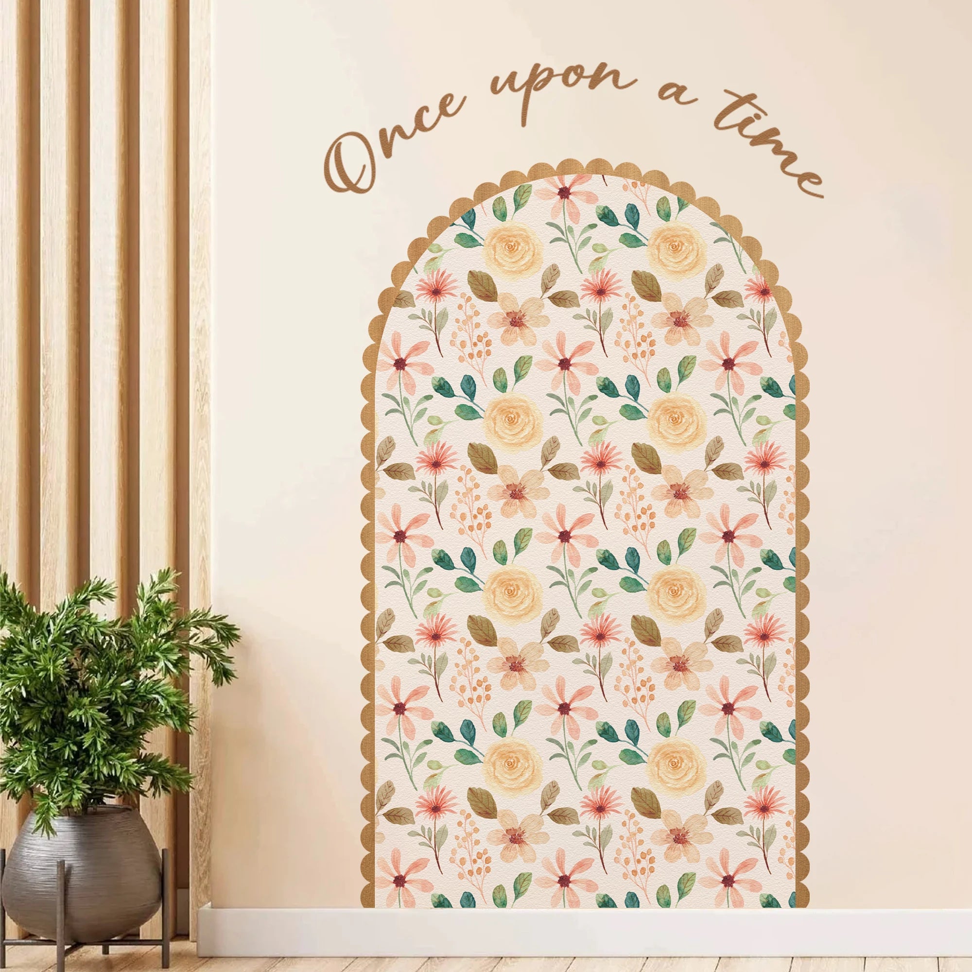 Decorative wall decal with floral pattern and 'Once upon a time' text on a beige wall.