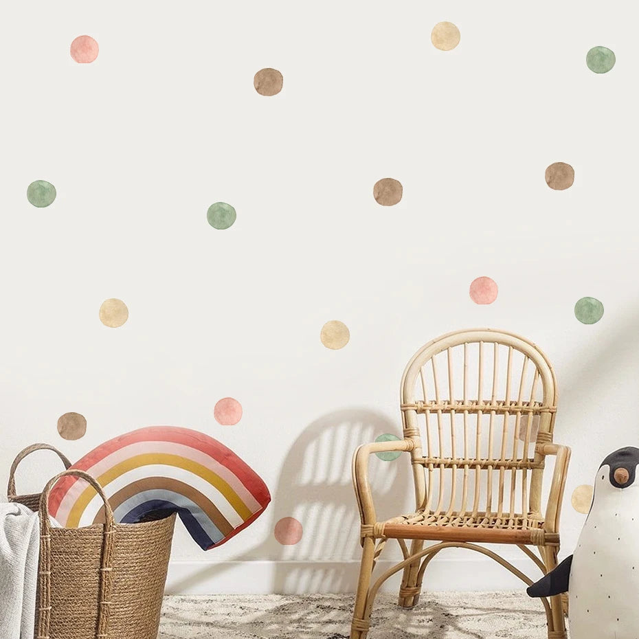 Wicker chair and basket against a wall with colorful polka dots