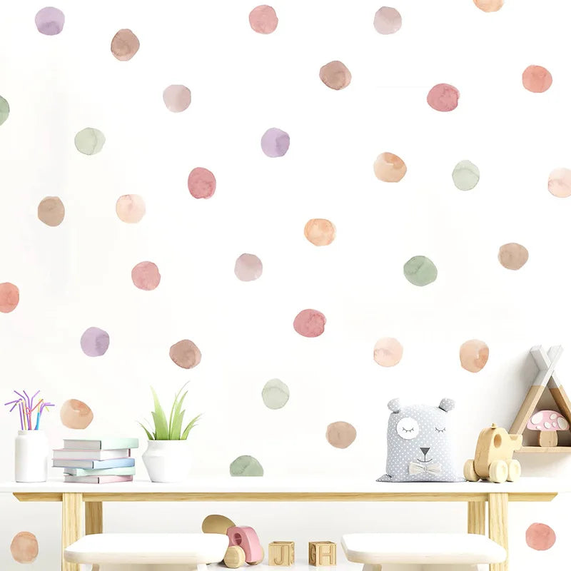 Children's room with pastel polka dot wall decals, toys, and a plant.