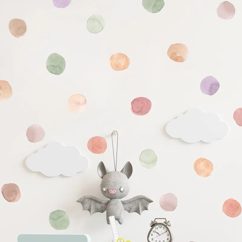 Plush toy bat with a clock on a polka dot background