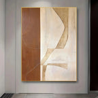 Abstract art painting in a gold frame on a wall