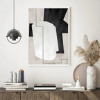 Modern interior design with abstract art, books, and decorative items on a shelf.