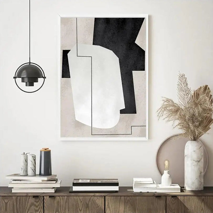 Modern interior design with abstract art, books, and decorative items on a shelf.