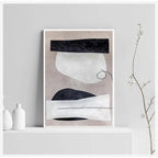 Abstract art print on a white wall with minimal decor