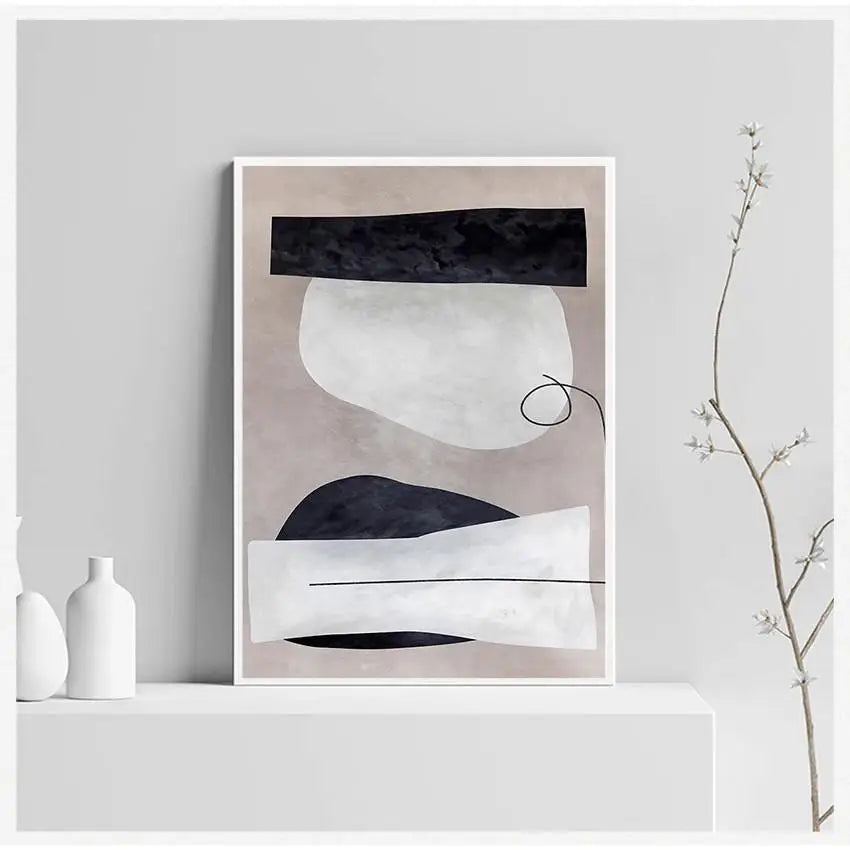 Abstract art print on a white wall with minimal decor