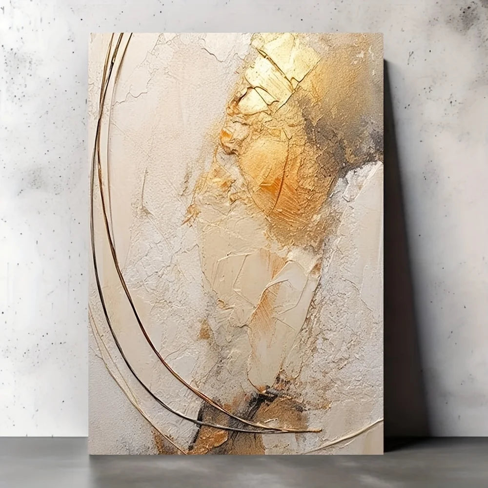 Abstract art piece with gold and beige tones on a textured wall.