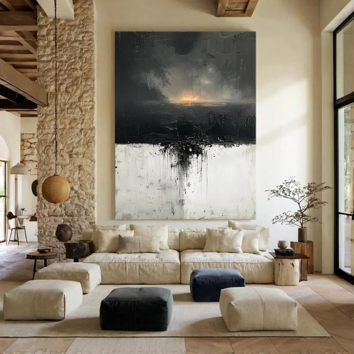 Modern living room with a large abstract painting on the wall, stone fireplace, and comfortable seating.