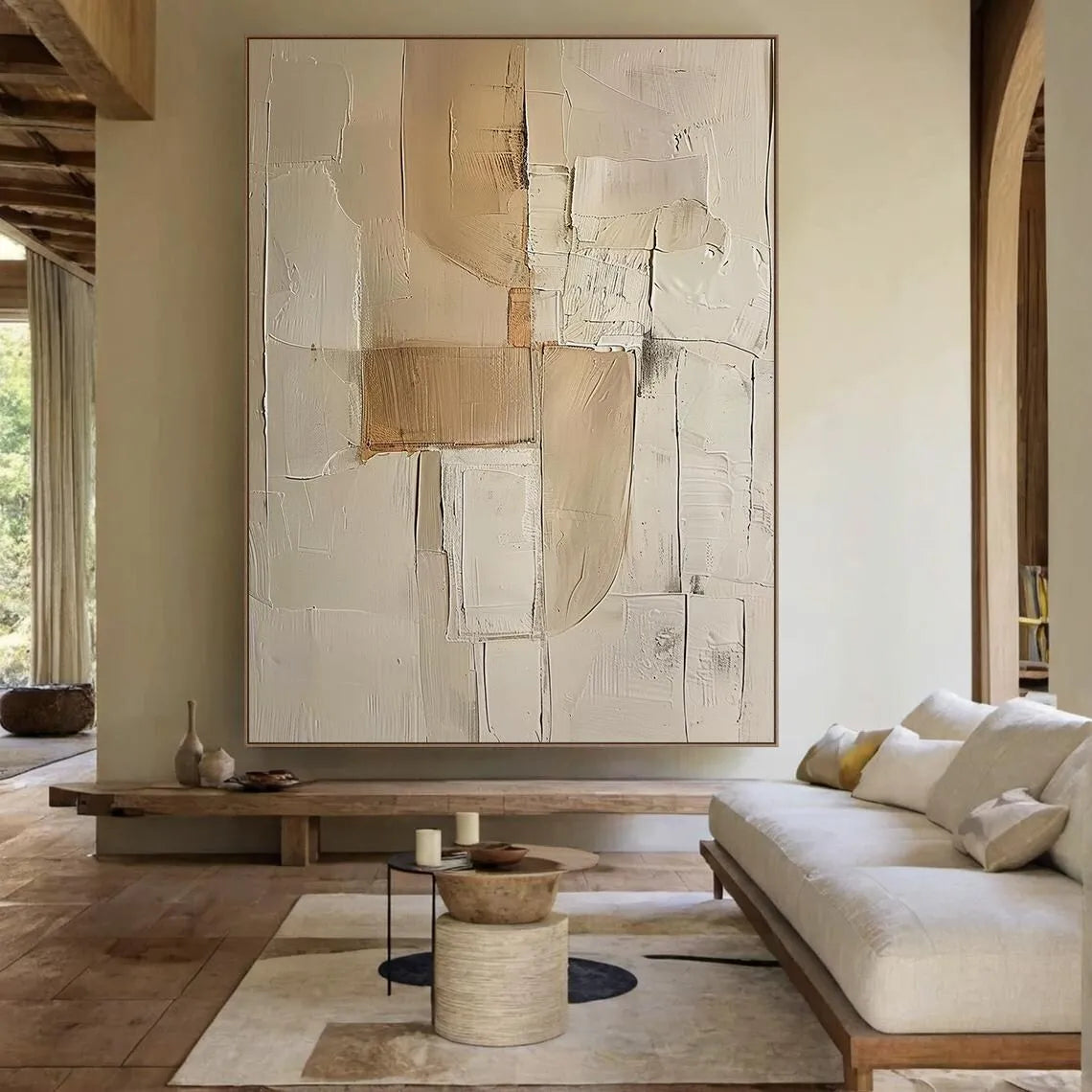 Living room with a large abstract painting on the wall, a sofa, and a coffee table.