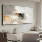 Abstract painting on a wall in a modern living room with a sofa and side table.