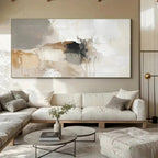 Modern living room with a large abstract painting on the wall above a sectional sofa.